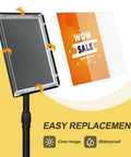 Sign Holder Floor Stand 8.5x11 Inch With Adjustable Height And Tilt Heavy Duty Base Snap Open Frame showing easy poster replacement