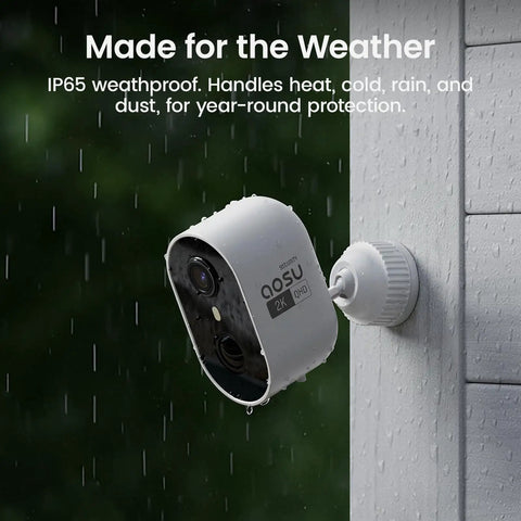 Wireless Outdoor Security Camera Kit With Local Storage 2K Resolution 6X Zoom 4 Camera System mounted on exterior wall in rain