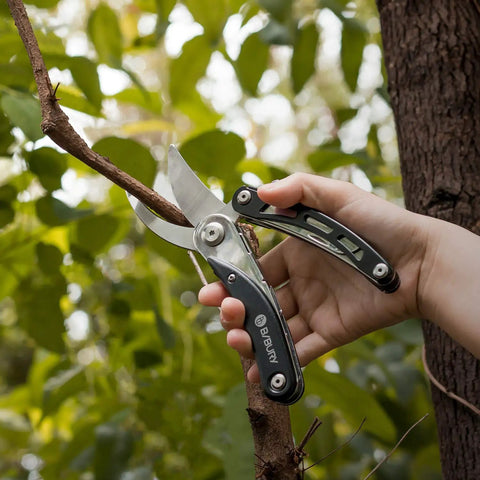 Five In One Garden Pruner Multitool With Folding Scissors And 420 Stainless Steel Blades cutting tree branch outdoors