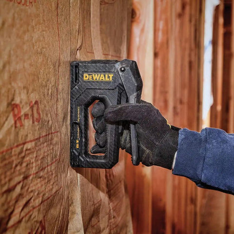 Carbon Fiber Body Workhorse 2 In 1 Staple Gun Tacker for Heavy Duty Staples and 18 Gauge Brads in use on insulation wall.