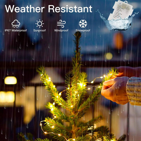Person decorating a small outdoor Christmas tree in rain with 200 LED Battery Operated Fairy Lights With Remote, 66Ft Silver-Coated Copper Wire