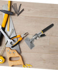 Assorted tools including a saw, wrench, pliers, and screws on a wooden surface, part of the Beefy Pro Grade Metal Bender Kit for 150 75 Series Light Steel.