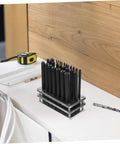 28 Piece Cylindrical Punch Set With Non Slip Base for Woodworking and Maintenance Tools on workshop table