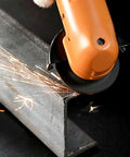 Workhorse Heavy Duty Handheld Angle Grinder cutting steel with sparks flying, showing 2 inch disc capacity for precision work.