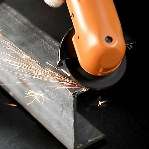Workhorse Heavy Duty Handheld Angle Grinder cutting steel with sparks flying, showing 2 inch disc capacity for precision work.