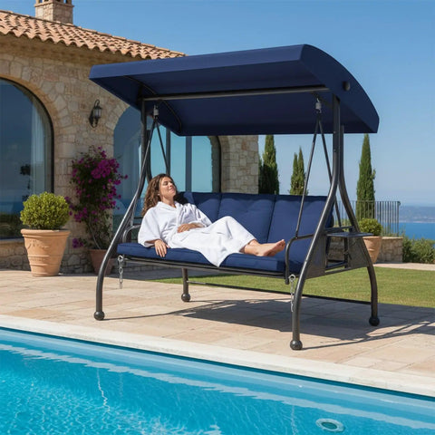 Three Seat Outdoor Porch Swing Glider With Adjustable Canopy Convertible Patio Bed by poolside with thick blue cushions