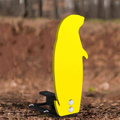 Three Eighths Inch AR500 Auto Reset Prairie Dog Target Popper, yellow steel shooting target, side view on rugged range ground