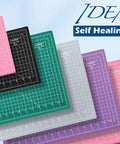 Multiple color self-healing cutting mats stacked with a focus on Beefed Up Super Dense 24 By 36 Inch Large Self Healing Rotary Cutting Mat For Sewing Crafts And Hobby Projects A1 Size 5 Ply Long Lasting Professional Cut Board Green