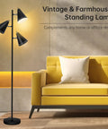 Triple Head Floor Lamp With 9W LED Bulbs, Three Color Temperature Settings, next to yellow sofa in living room, black finish