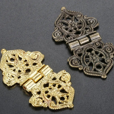Snag The Goods On These Rad Antique Lace Hinges 10 Piece Set Zinc Alloy With Mounting Screws Gray 53 X 28 Mm showing gold and black decorative hinges.