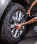 Using Billy Club Universal Lug Wrench For Quick Tire Changes And Break Loose Lug Nuts, SAE And Metric Fit, roadside tool in action
