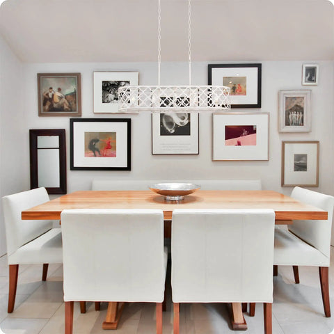 Sutton 35-Inch Five-Light Modern Island Light With Open Design Quatrefoil Metal Shade In Rustic Antique White Finish above dining table