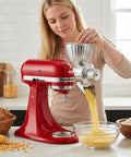 Person using Grain Mill Attachment For KitchenAid Stand Mixer With Nine Grind Levels For Fresh Flour From Wheat Corn Oats Millet And Coffee Beans Easy Tool Free Setup And Uses Your Mixer Power For Efficient Grinding