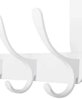 Close-up of white over the door coat hooks with five hooks and towel rack door hanger for coats and clothes space saving white organizer