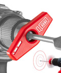 Close-up of Magnetic Red Laser Drill Guide delivering straight as an arrow holes aiming at a red bullseye pattern.