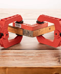 Two 9 Inch Heavy Duty Spring Clamps With Kickass Grip holding a wooden board and a red block for woodworking tasks.
