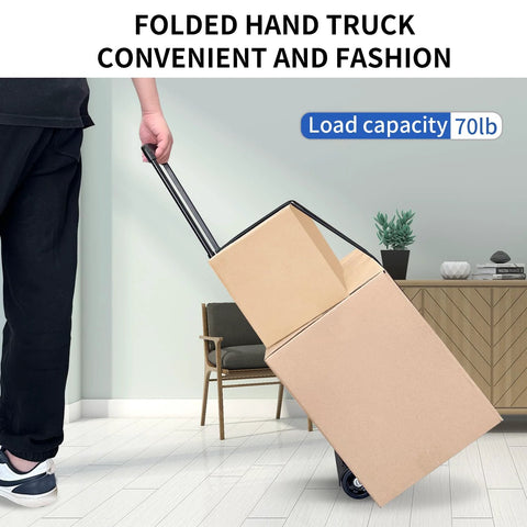 Side view of folding hand truck with a black frame carrying two cardboard boxes on wheels