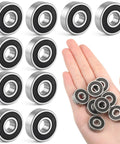 Hand holding 10-Pack 608-RS Ball Bearings With Double Rubber Seals For Skateboards Inline Skates Scooters Roller Blades And Longboards, Pro Grade Deep Groove Bearings For Smooth Spin And Lasting Durability, 8mm x 22mm x 7mm; stainless steel design