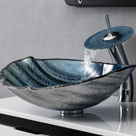 Game Changing Shell Shape Vessel Sink With Tempered Glass Bathroom Vanity Basin, Includes Faucet And Pop Up Drain, above counter sink in use with flowing water.