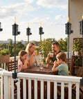 6 Pack Garden Torch With Universal Clamp, 16 Oz Citronella Oil Outdoor Torches and happy family on a balcony.