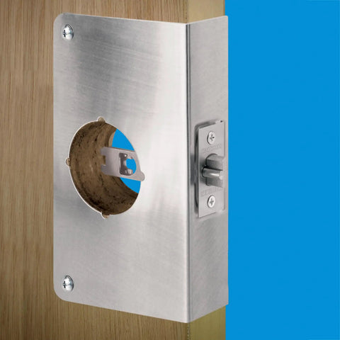 Stainless Steel Door Lock Reinforcement Plate for 1-3/4 Inch Thick Doors mounted on wood with latch detail.