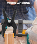 16 Pack Small Spring Clamps 3 Point 5 Inch Heavy Duty Clips For Backdrop Stand And Crafts Plastic Backdrop Clips For Woodworking Photography And Outdoor Use Built Tough Durable Nylon Pads With Detachable Orange Cushioned Pads For Secure Grips on a wooden board during woodworking.