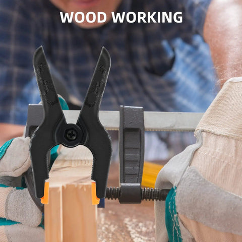 16 Pack Small Spring Clamps 3 Point 5 Inch Heavy Duty Clips For Backdrop Stand And Crafts Plastic Backdrop Clips For Woodworking Photography And Outdoor Use Built Tough Durable Nylon Pads With Detachable Orange Cushioned Pads For Secure Grips on a wooden board during woodworking.