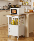 Slick Rolling Microwave Cart With Boss Level Storage Built Onto A Rock Solid Rubberwood Base, Crisp White Kitchen Island Station with olive oil and kitchen tools.