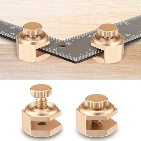 Rock Solid Four Pack Aluminum Stair Gauge Set For Framing Squares Gold Pro Gear Quick Slide Clamps close-up on clamps with framing square.