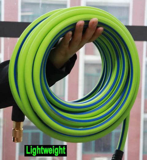 Coiled green Beefy One Quarter Inch Air Hose Built For Tough Jobs One Hundred Foot Long 300 PSI Burst Flexible held by hand