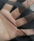 Close-up of black see through mosquito netting for patio and porch, breathable polyester with ultra fine 0.8mm holes.