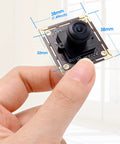 Close-up of 16MP Wide Angle USB Camera Module With 180 Degree Fisheye Lens For Linux Windows Android Mac held in hand.