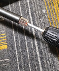 Close-up of Extra Long 90mm Flap Wheel Sanding Set With 1 Quarter Inch Shank For Drill Grinder And Rotary Tools in use on a carpeted surface