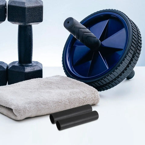 Black anti-slip handle grips for barbells and weights with wheel, dumbbells, and towel on a gym surface