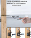 Heavy Duty Self Latching Gate Hook With Spring Release Cable, carbon steel latch on wood, demonstrating easy pull design.