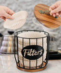 Rustic Coffee Filter Holder With Lid Built From Acacia Wood And Metal, showing filters being placed inside on a countertop.