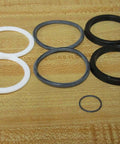 Hydraulic pump seal kit P-106874-K0002 P106874K0002 7-piece replacement o-ring gasket set with black and white rings on table