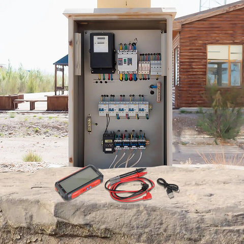 FS899L All In One Digital Multimeter with cables in front of an electrical panel outdoors, for automotive, home, industrial use
