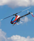 Fusion 700 Kit High Performance Super Combo With Carbon Fiber 700mm Main Rotor And 105mm Tail Blades, blue sky background.