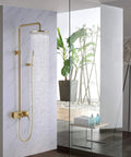 Slick Brushed Gold Rainfall Shower Kit With 10 Inch Mass Flow Head And Easy Grip Handheld Sprayer mounted on modern bathroom wall.