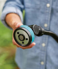 Close-up of Heavy Duty Swivel Connect Watering Wand Hose Sprayer With Five Spray Patterns, held by a person in blue shirt