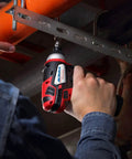 Heavy Duty Cordless Three Tool Combo Kit Featuring Power Drill Driver Snappy Impact Driver And Socket Ratchet With Two Swap Out Batteries For Weekend Warriors, showing a hand gripping an impact driver.