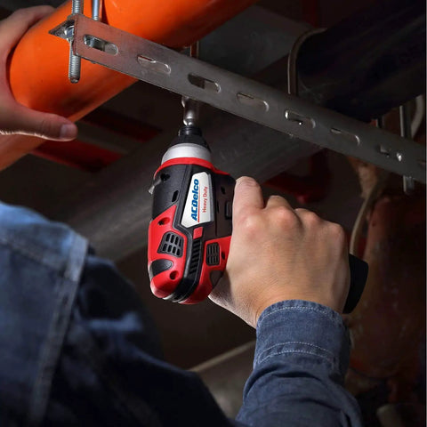 Heavy Duty Cordless Three Tool Combo Kit Featuring Power Drill Driver Snappy Impact Driver And Socket Ratchet With Two Swap Out Batteries For Weekend Warriors, showing a hand gripping an impact driver.