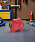 Slick Automatic Aerosol Fire Extinguisher With Smart Sensor Detection Strong Adhesive Backing Road Ready in workshop setting.