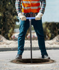 Person using Adjustable Water Meter Key With 15 Inch And 28 Inch Lengths For Opening And Closing Meters Or Valves outdoors