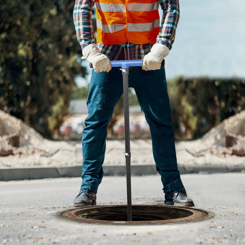 Person using Adjustable Water Meter Key With 15 Inch And 28 Inch Lengths For Opening And Closing Meters Or Valves outdoors