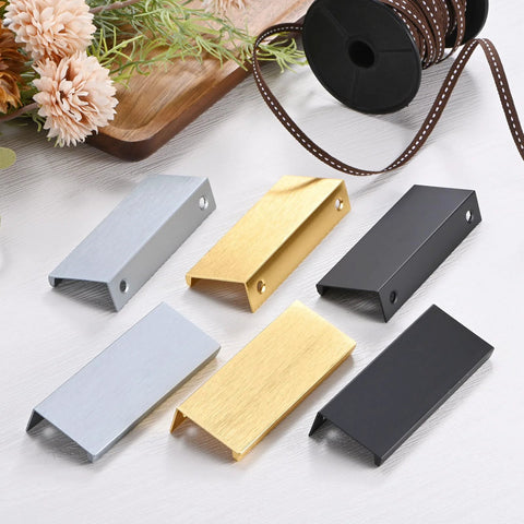 Six-Pack Aluminum Drawer Edge Pulls 3.15 Inch Concealed Tab Handles in brushed grey and other finishes on tabletop