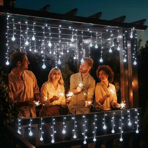 Dope Christmas Globe Curtain Lights 11.5Ft 96LED Crystal Ball Fairy Lights with people outdoors in evening setting