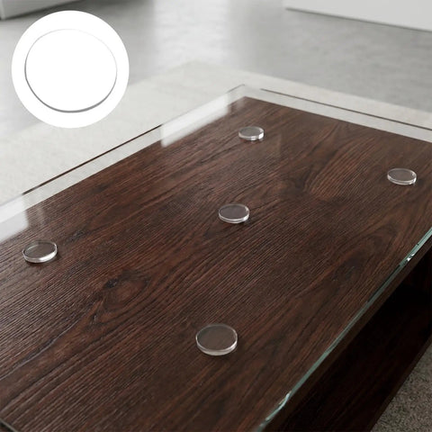 16 Pack Non Adhesive Rubber Feet for Glass Tables and Counters Transparent No Slip Cushions on wooden table close-up