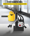 Powerful 750W Magnetic Drill Press With Strong 8500N Magnet Force on a steel surface, compact design for easy mobility.
